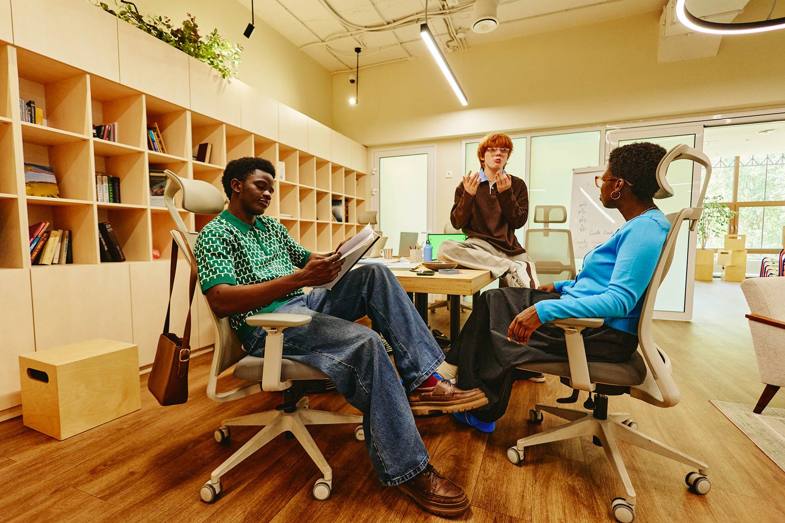 Diverse Colleagues Brainstorming and Collaborating in Modern Office